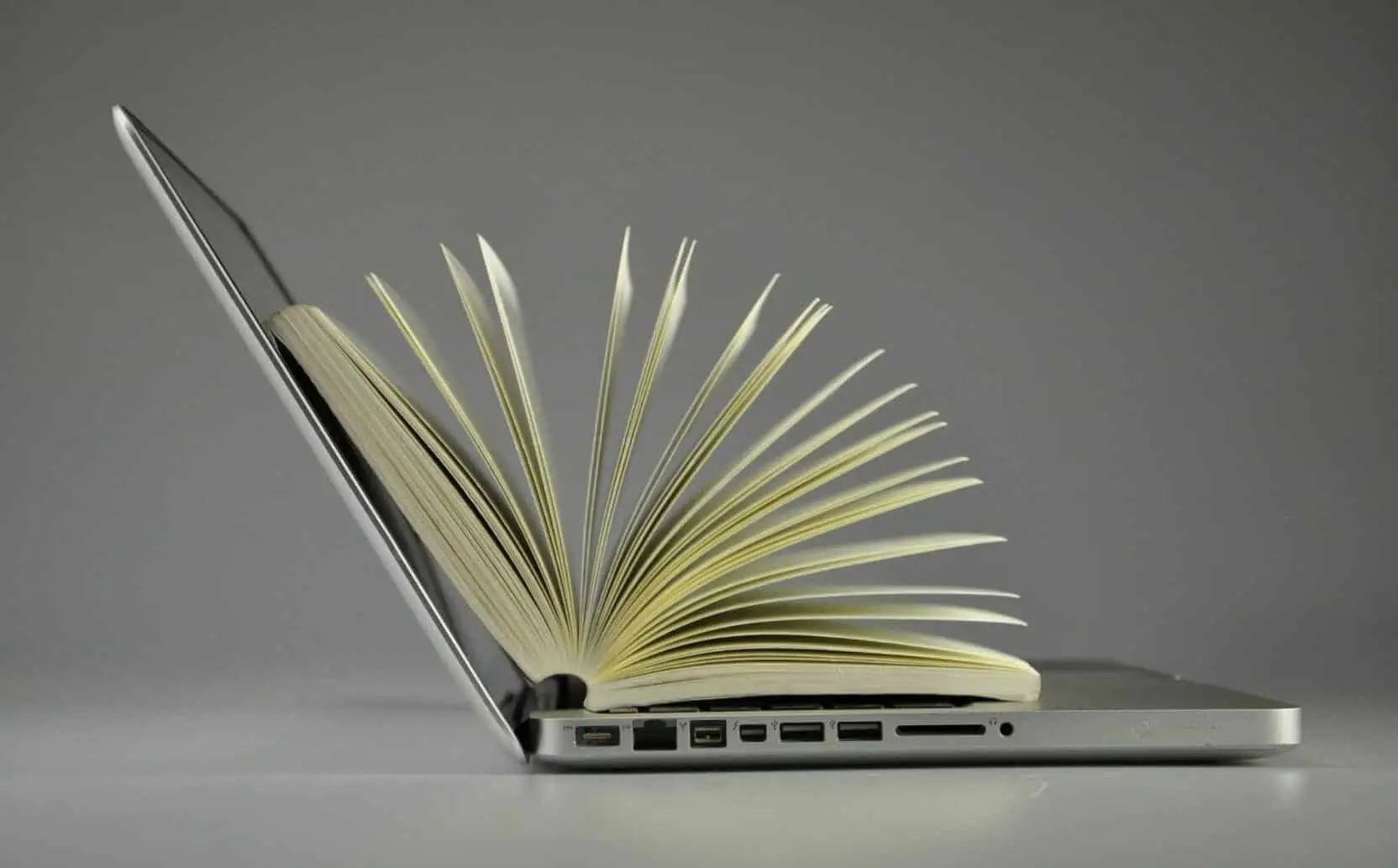 a book over the laptop