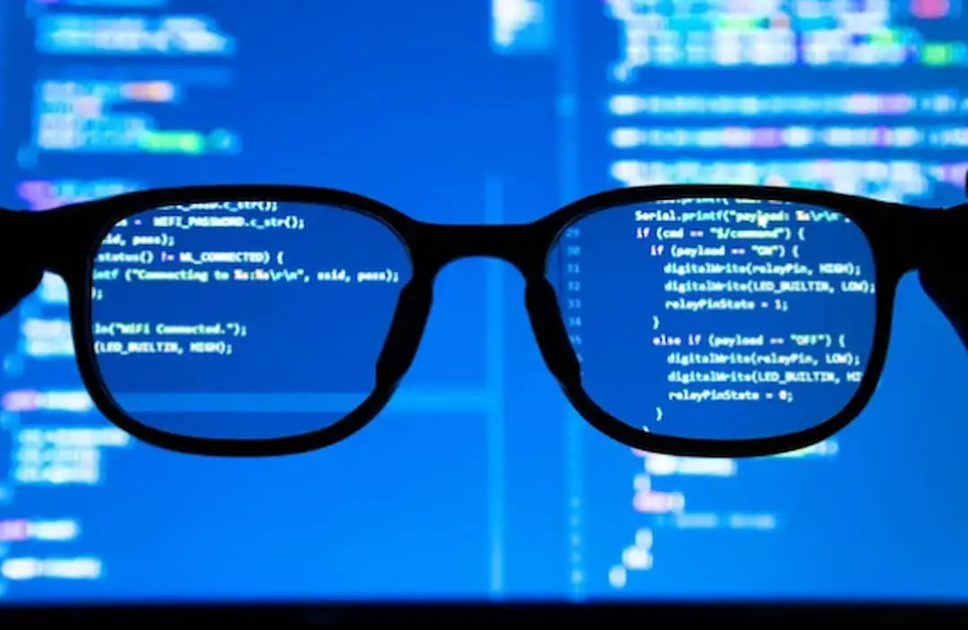 glasses in front of the monitor screen