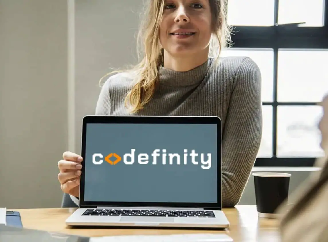 Codefinity logo on the laptop screen and the girl in the background