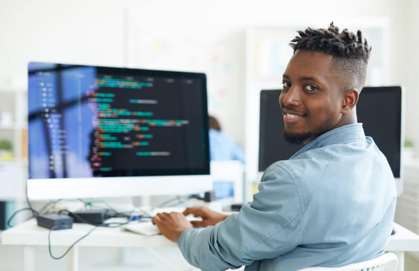 A man on a PC coding